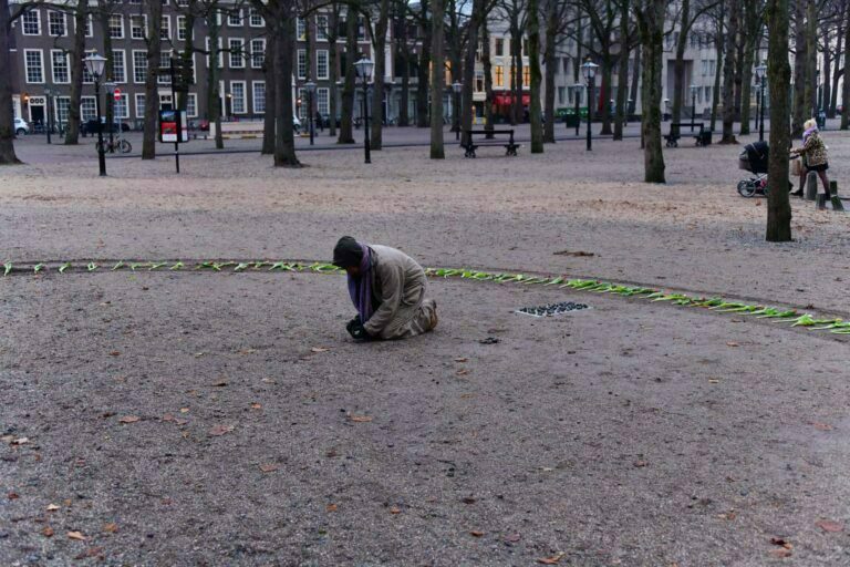 Philemon Mukarno Performance Art War flowers (2018)2h The Embodiment of Time Festival, Het Lange Voorhout, The Hague, Netherlands.
