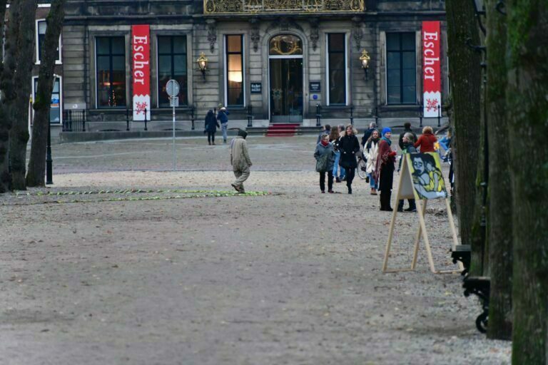 Philemon Mukarno Performance Art War flowers (2018)2h The Embodiment of Time Festival, Het Lange Voorhout, The Hague, Netherlands.