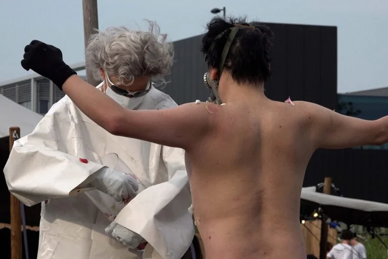 Naked Performance Art for Spiritual Healing by Ingrid Adriaans and Philemon Mukarno in Amsterdam