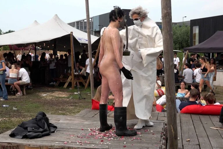 Naked Performance Art for Spiritual Healing by Ingrid Adriaans and Philemon Mukarno in Amsterdam
