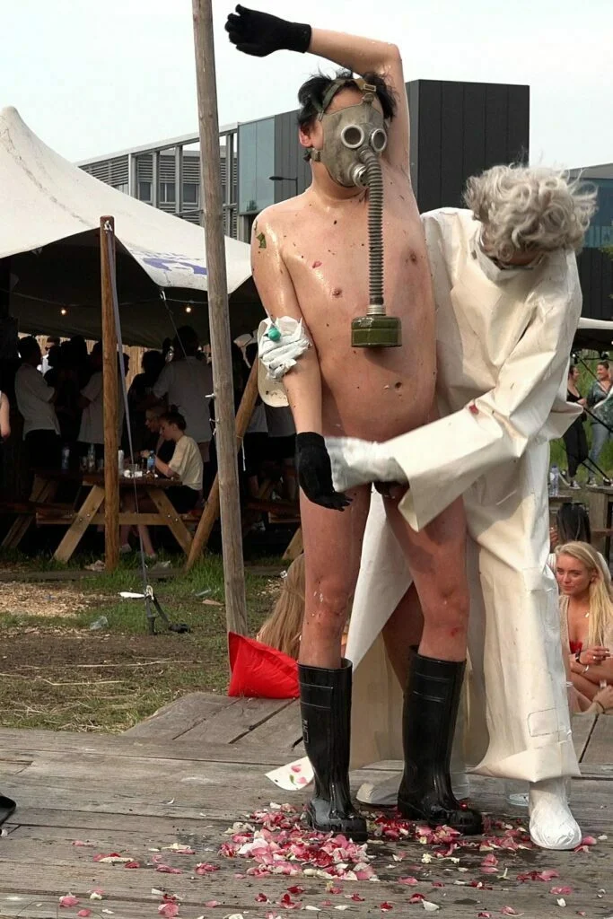 Naked Performance Art De-Coronasation for Spiritual Healing by Ingrid Adriaans and Philemon Mukarno in Amsterdam