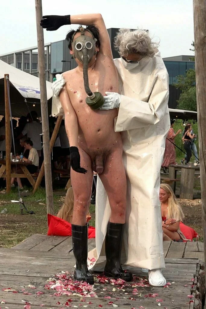 Naked Performance Art De-Coronasation for Spiritual Healing by Ingrid Adriaans and Philemon Mukarno in Amsterdam