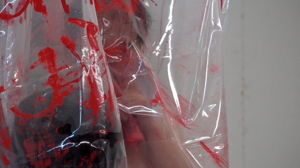 Philemon Mukarno bleeding and naked inside the plastic bag suffocating