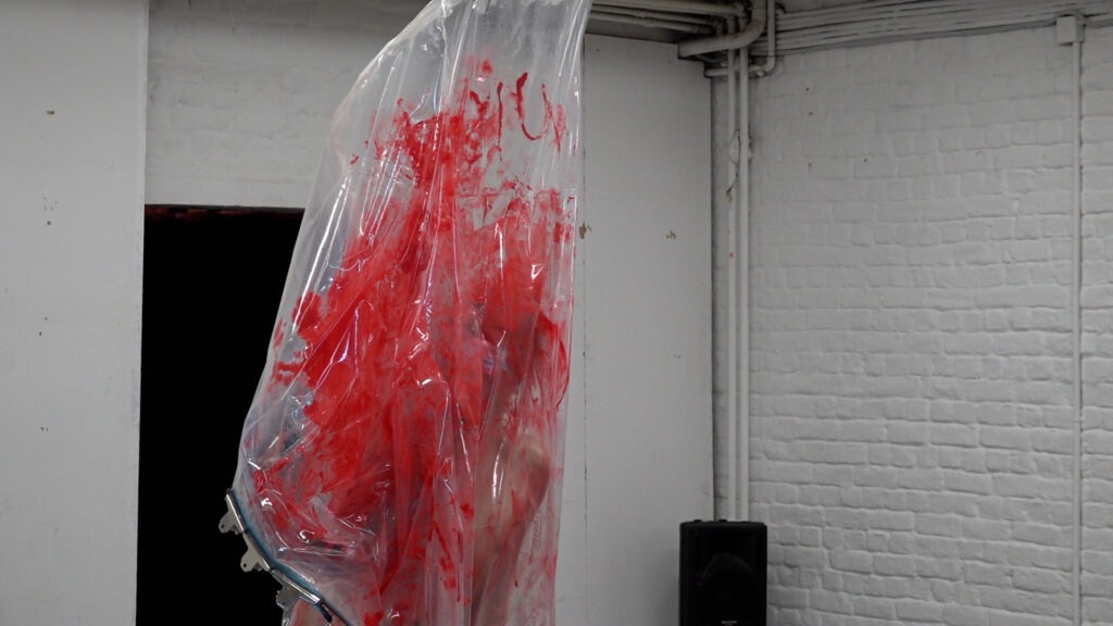 Philemon Mukarno bleeding and naked inside the plastic bag suffocating