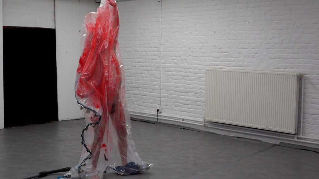 Philemon Mukarno bleeding and naked inside the plastic bag suffocating