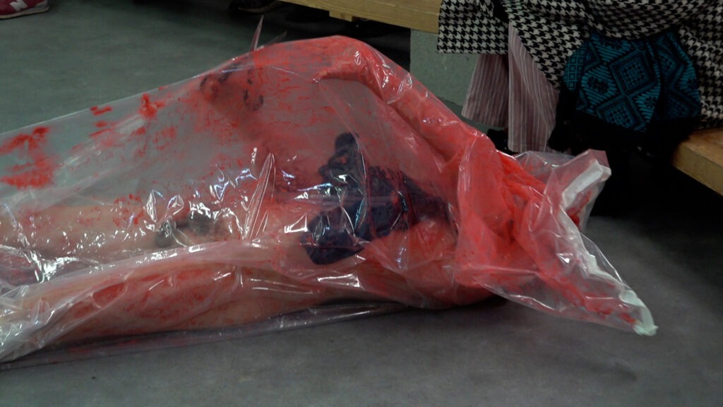 Philemon Mukarno bleeding and naked inside the plastic bag suffocating