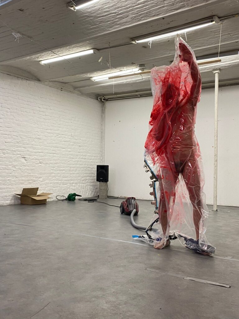 Philemon Mukarno bleeding and naked inside the plastic bag suffocating