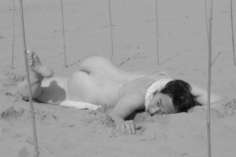 Philemon Mukarno performing naked at the Scheveningen beach in the Netherlands