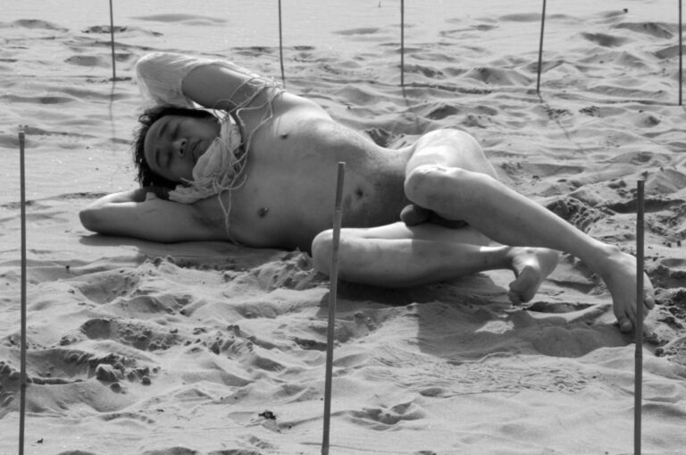 Philemon Mukarno performing naked at the Scheveningen beach in the Netherlands