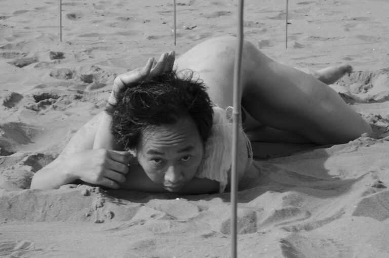 Philemon Mukarno performing naked at the Scheveningen beach in the Netherlands