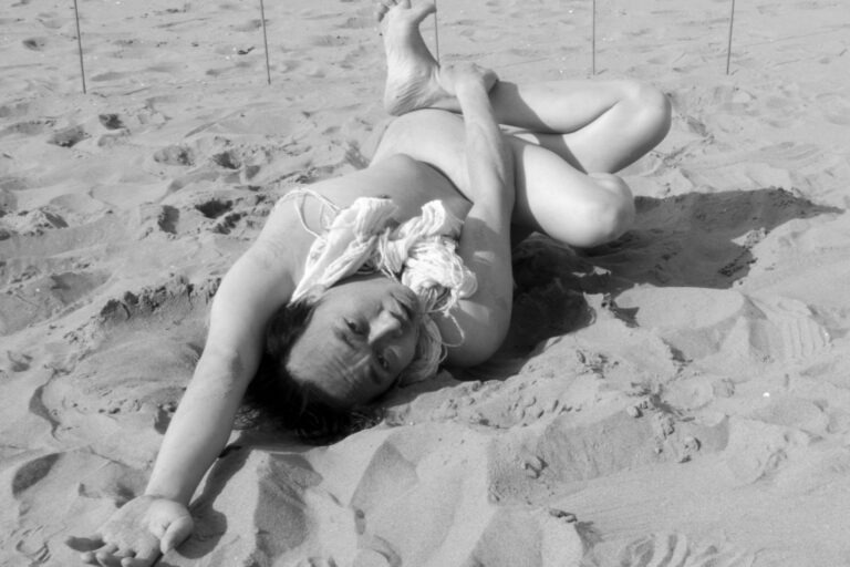 Philemon Mukarno performing naked at the Scheveningen beach in the Netherlands