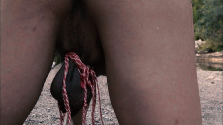 Philemon Mukarno is naked and he craw on the ground with stones hanging on his testicles