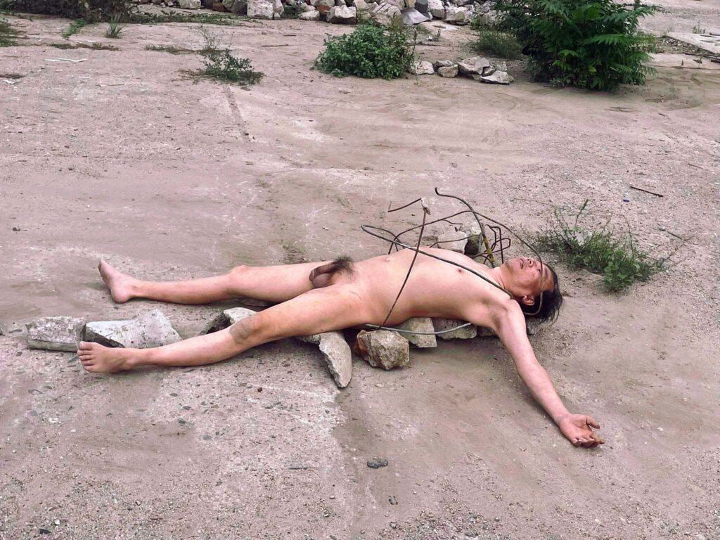 Philemon Mukarno Naked on the ground
