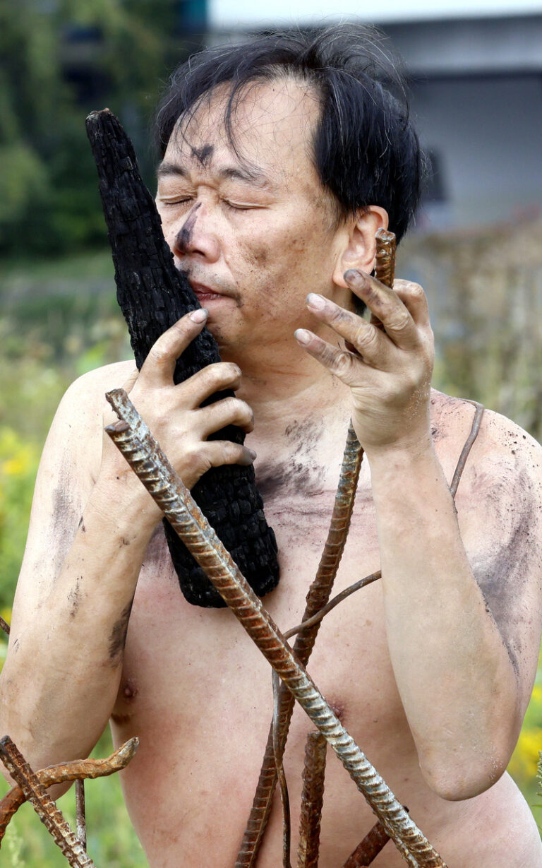 Philemon Mukarno performance artist perform Naked as Trans 9th Festival of Naked Forms in Prague