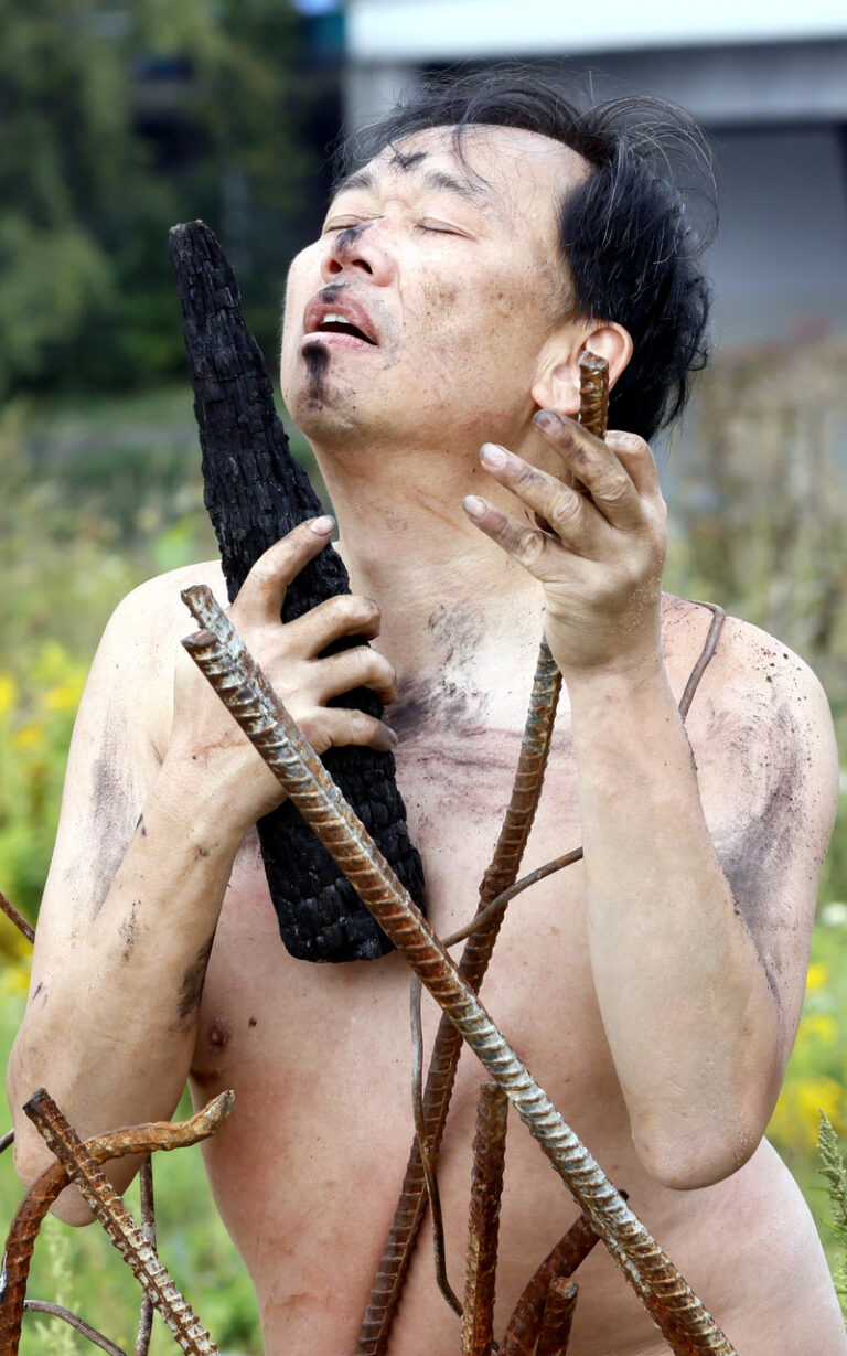 Philemon Mukarno performance artist perform Naked as Trans 9th Festival of Naked Forms in Prague