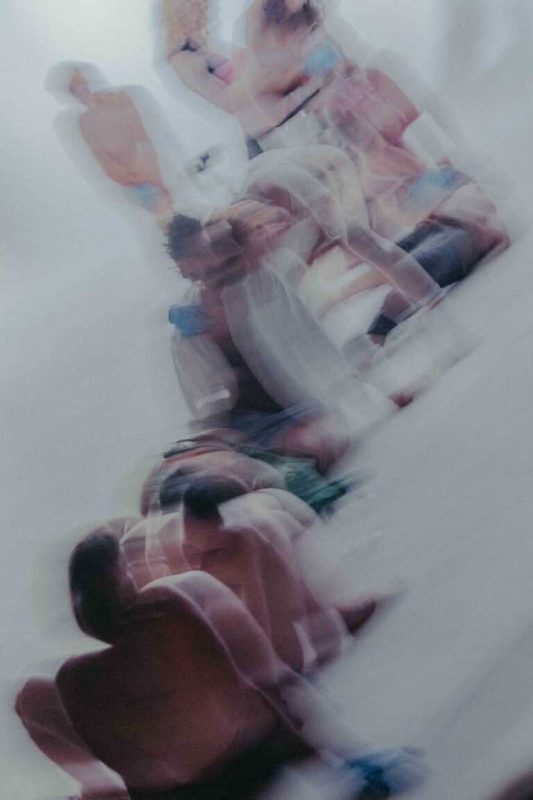 Naked abstract moving figures in pink and blue