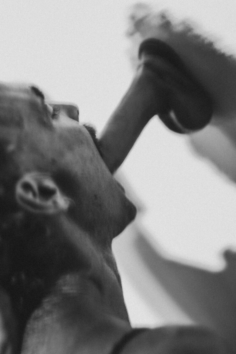 Two naked women in dynamic dance poses with expressive arm movements